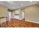 Spacious room featuring hardwood floors, neutral walls, and access to multiple rooms at 229 N Buteo Woods Ln, Las Vegas, NV 89144