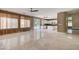 Open floor plan featuring a living room with neutral paint and access to the backyard at 229 N Buteo Woods Ln, Las Vegas, NV 89144