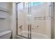 Bathroom featuring a single sink, a large mirror, and a glass enclosed tub shower at 2413 Rockford St, Las Vegas, NV 89134
