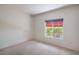 Bright bedroom featuring neutral carpet and a window with natural light at 2413 Rockford St, Las Vegas, NV 89134