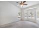 Bright bedroom with a ceiling fan, bay window and views of the surrounding landscape at 2413 Rockford St, Las Vegas, NV 89134
