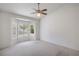 Standard bedroom with a ceiling fan, bay window and views of the surrounding landscape at 2413 Rockford St, Las Vegas, NV 89134