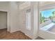 Bright entryway featuring tile floors, sidelight windows, and a white front door with decorative glass at 2413 Rockford St, Las Vegas, NV 89134