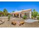 Beautiful home with a covered patio, well-maintained yard, and desert landscaping elements at 2413 Rockford St, Las Vegas, NV 89134