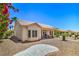 Charming home with a well-manicured front yard, desert landscaping, and inviting curb appeal at 2413 Rockford St, Las Vegas, NV 89134