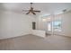 Large living room with carpeted floors, large windows and an open-concept design with lots of light at 2413 Rockford St, Las Vegas, NV 89134
