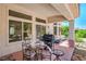 Inviting covered patio with table and chairs, creating a cozy outdoor living space at 2413 Rockford St, Las Vegas, NV 89134