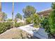 This backyard features a concrete patio and lush landscaping at 2528 Huber Heights Dr, Las Vegas, NV 89128