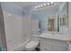 This bathroom has light blue walls and a white shower and vanity at 2528 Huber Heights Dr, Las Vegas, NV 89128