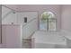 Soaking tub and tiled stand-up shower next to a window for plenty of natural light in bathroom at 2528 Huber Heights Dr, Las Vegas, NV 89128