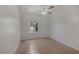 Light-filled bedroom features a large window and hardwood floors at 2528 Huber Heights Dr, Las Vegas, NV 89128