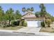 Inviting single-story home featuring a lush front lawn and a two-car garage at 2528 Huber Heights Dr, Las Vegas, NV 89128