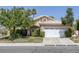 Charming single-story home with a well-maintained front yard and a two-car garage at 2528 Huber Heights Dr, Las Vegas, NV 89128