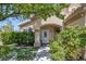 Close up of the front door surrounded by lush landscaping at 2528 Huber Heights Dr, Las Vegas, NV 89128