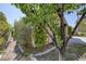 Home featuring beautiful landscaping and mature trees at 2528 Huber Heights Dr, Las Vegas, NV 89128