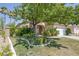 Beautiful home with a well-manicured lawn and mature trees providing shade at 2528 Huber Heights Dr, Las Vegas, NV 89128