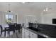 Spacious eat-in kitchen showcasing dark granite countertops and a large sink at 2528 Huber Heights Dr, Las Vegas, NV 89128