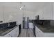 Bright kitchen featuring stainless steel appliances and granite countertops, plus a ceiling fan at 2528 Huber Heights Dr, Las Vegas, NV 89128
