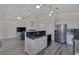 Open kitchen with granite counters, stainless appliances, and an island with a sink at 2528 Huber Heights Dr, Las Vegas, NV 89128