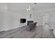 Open living room featuring a fireplace, light wood floors, and recessed lighting at 2528 Huber Heights Dr, Las Vegas, NV 89128