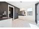 Modern bathroom featuring dual sinks, black countertops, and sleek hexagonal tiled floors at 2722 Marchetti Pl, Henderson, NV 89044