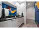 Charming bathroom with double vanity, modern fixtures, and unique mermaid-themed mural at 2722 Marchetti Pl, Henderson, NV 89044