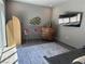 Relaxing bedroom with natural light, stylish decor, and a comfortable seating arrangement at 2722 Marchetti Pl, Henderson, NV 89044