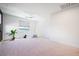 Spacious bedroom with a large window, neutral carpet, and a cozy play area at 2722 Marchetti Pl, Henderson, NV 89044
