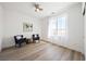 A minimalist bedroom with hardwood floors, bright natural light, and modern decor for relaxation at 2722 Marchetti Pl, Henderson, NV 89044