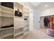Spacious walk-in closet featuring ample shelving, drawers, and organized storage solutions at 2722 Marchetti Pl, Henderson, NV 89044