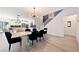 Elegant dining room features stylish chandelier and convenient access to kitchen and staircase at 2722 Marchetti Pl, Henderson, NV 89044