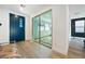 Bright entryway with blue accent door and sliding glass doors to the yoga room at 2722 Marchetti Pl, Henderson, NV 89044
