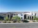 Charming two-story home boasting modern design elements with desert landscaping and clear blue skies at 2722 Marchetti Pl, Henderson, NV 89044