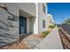 Modern home showcasing its front entrance and manicured landscaping, blending aesthetics and functionality at 2722 Marchetti Pl, Henderson, NV 89044
