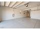 A spacious garage with clean epoxy flooring and ample space offers storage and parking at 2722 Marchetti Pl, Henderson, NV 89044