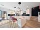 A modern kitchen featuring a large island with seating, pendant lighting, and stainless steel appliances at 2722 Marchetti Pl, Henderson, NV 89044