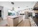 Spacious kitchen showcasing a center island with seating, stainless steel appliances, and sleek cabinetry at 2722 Marchetti Pl, Henderson, NV 89044
