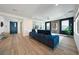 Spacious living room features modern furniture, wood floors, and stylish decor at 2722 Marchetti Pl, Henderson, NV 89044