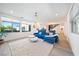 Bright living room with plush seating, hardwood floors, and large windows offering plenty of natural light at 2722 Marchetti Pl, Henderson, NV 89044