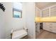 Convenient mudroom with built-in storage, a bench, and natural light from the window at 2722 Marchetti Pl, Henderson, NV 89044