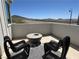 Modern patio features stylish seating, a fire pit, and scenic mountain views at 2722 Marchetti Pl, Henderson, NV 89044