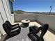 Modern patio features stylish seating, a fire pit, and scenic mountain views at 2722 Marchetti Pl, Henderson, NV 89044