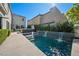 The backyard is complete with a pool, hot tub, and landscaping for a relaxing outdoor experience at 2722 Marchetti Pl, Henderson, NV 89044