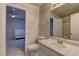 Light-filled bathroom with a mirror, single sink vanity and open layout to a bedroom at 278 Star Cluster Cir, Las Vegas, NV 89145