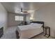 Well lit bedroom with gray carpet, ceiling fan, and comfortable furnishings at 278 Star Cluster Cir, Las Vegas, NV 89145