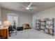 Spacious office area featuring light filled window, fan and carpeted floors at 278 Star Cluster Cir, Las Vegas, NV 89145