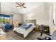 Cozy bedroom with a ceiling fan, window, and neutral carpet at 2851 S Valley View Blvd # 1071, Las Vegas, NV 89102