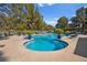 Community pool and deck area with chairs and greenery, perfect for relaxation and recreation at 2851 S Valley View Blvd # 1071, Las Vegas, NV 89102