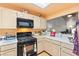 This kitchen has updated appliances, ample counter space, and a view to the dining area at 2851 S Valley View Blvd # 1071, Las Vegas, NV 89102