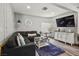 Comfortable living room featuring a sectional sofa, stylish decor, and sleek television at 2851 S Valley View Blvd # 1071, Las Vegas, NV 89102